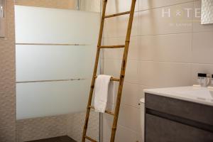 a bathroom with a ladder next to a sink at Maison neuve - la Marinière - classée 4 étoiles - emplacement idéal in Les Sables-dʼOlonne +47 photos