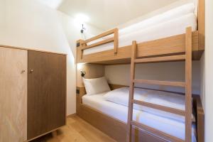 Voodi või voodid majutusasutuse Hotel Tofana toas