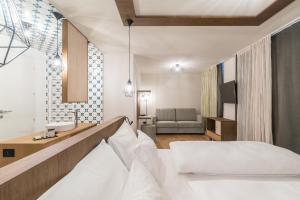 Voodi või voodid majutusasutuse Hotel Tofana toas
