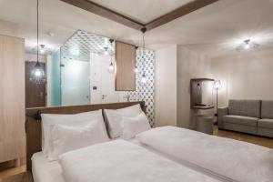 Voodi või voodid majutusasutuse Hotel Tofana toas