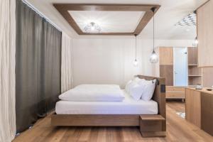 Voodi või voodid majutusasutuse Hotel Tofana toas
