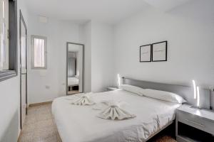 Postel nebo postele na pokoji v ubytování Island Sun