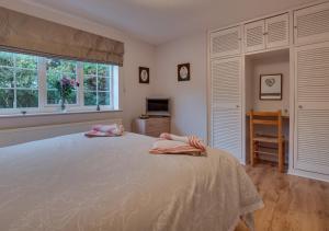 a bedroom with a large bed with two pillows on it at Heather House in Whitby