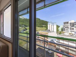 a view from the window of a building at Studio 4 pers, pied des pistes, balcon, kitchenette équipée, Gourette - FR-1-400-46 in Gourette