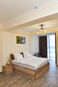 Ένα ή περισσότερα κρεβάτια σε δωμάτιο στο Altunyan Hotel