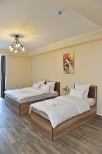 Ένα ή περισσότερα κρεβάτια σε δωμάτιο στο Altunyan Hotel
