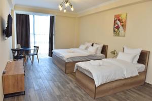 Ένα ή περισσότερα κρεβάτια σε δωμάτιο στο Altunyan Hotel