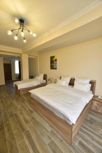 Ένα ή περισσότερα κρεβάτια σε δωμάτιο στο Altunyan Hotel