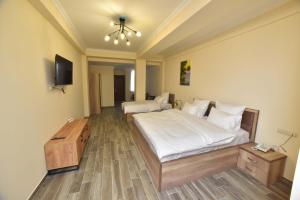 Ένα ή περισσότερα κρεβάτια σε δωμάτιο στο Altunyan Hotel