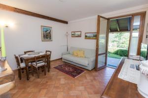 a living room with a table and a couch at Borgo Caiano Country Inn in Caiano