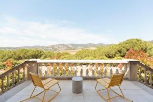 a balcony with chairs and a view of mountains at Luxury Seaview Villa by Olala Homes in Teià +31 photos