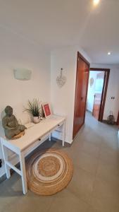 a room with a table and a rug on the floor at Moraira Beach in Moraira