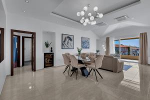 a living room with a dining table and a couch at Apartment Star in Makarska
