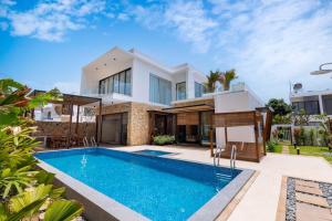 an image of a house with a swimming pool at Hoàng My Villa S7 in Vung Tau