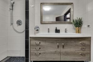 a bathroom with a sink and a mirror at Apartment Star in Makarska