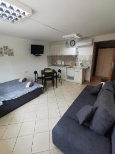 a living room with a couch and a table at Wyspani Zator in Zator