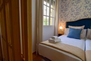 Posteľ alebo postele v izbe v ubytovaní Letmalaga Casa Basilisa