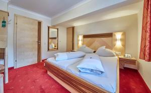 Voodi või voodid majutusasutuse Apart-Hotel Forellenhof toas