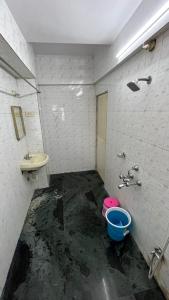 a dirty bathroom with a sink and a toilet at Hotel Plaza Rooms - Prabhadevi Dadar in Mumbai