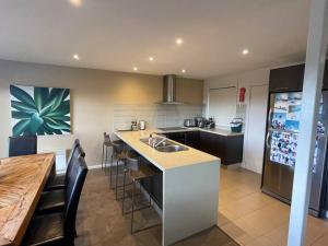 a kitchen with a sink and a counter top at IceBreaker - Mount Hotham in Mount Hotham