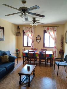 a living room with a table and chairs at Casas Mirabel in Mirabel