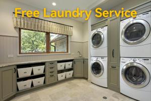 a laundry room with two washer and dryer at Wenjun Courtyard Hotel ---5 mins walk from Tonghuimen metro station, near Tianfu square, close by culture park and Sichuan opera house, English speaking service, local tours in Chengdu
