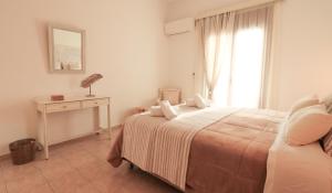 Posteľ alebo postele v izbe v ubytovaní Comfortable Apartment with Garden - Casa con Vista