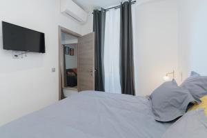 Posteľ alebo postele v izbe v ubytovaní IMHOST -Cannes Centre Rue Hoche Palais - Croisette plage