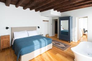 A bed or beds in a room at Casa Perazzolo