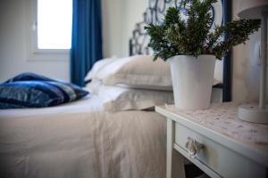 A bed or beds in a room at Audaces Resort