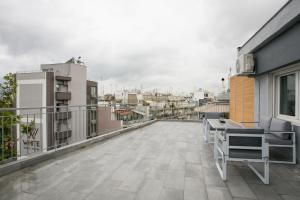 a balcony with a view of a city at White City Stay in Thessaloniki