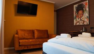 Postel nebo postele na pokoji v ubytování Hotel Porta Nigra