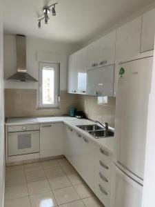 Kuchyň nebo kuchyňský kout v ubytování Apartman Daniela