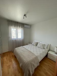 Postel nebo postele na pokoji v ubytování Apartman Daniela