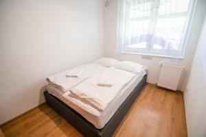 Posteľ alebo postele v izbe v ubytovaní Apart-Invest Apartament Hajduczek