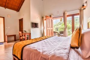 Postel nebo postele na pokoji v ubytování Hill Crest Resort - Coorg