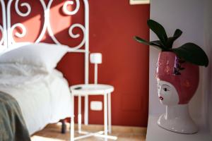 A bed or beds in a room at Audaces Resort