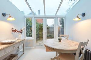 a dining room with a table and a window at 51 Risbygate Street Bury St Edmunds in Bury Saint Edmunds