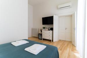 Postel nebo postele na pokoji v ubytování Residenza Leoncino