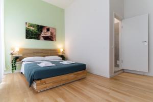 Postel nebo postele na pokoji v ubytování Residenza Leoncino