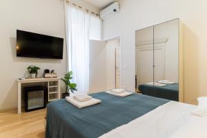 Postel nebo postele na pokoji v ubytování Residenza Leoncino