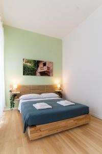 Postel nebo postele na pokoji v ubytování Residenza Leoncino