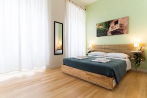 Postel nebo postele na pokoji v ubytování Residenza Leoncino