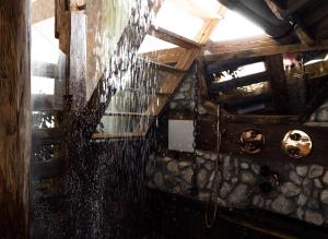 an overhead view of a room with rain on the ceiling at Naturerlebnis Suite - Nationalpark in Ramsau