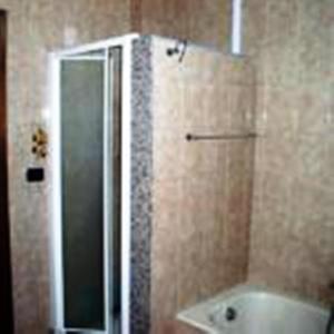 a bathroom with a shower and a sink and a tub at B&B Santa Lucia in Sogliano Cavour +25 photos