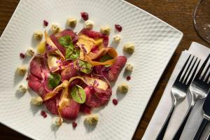 a white plate with food on a table at The Tongue Hotel in Tongue +73 photos