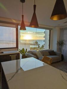a living room with a couch and a table at Ocean View Penthouse in P.V. Romantic Zone in Puerto Vallarta