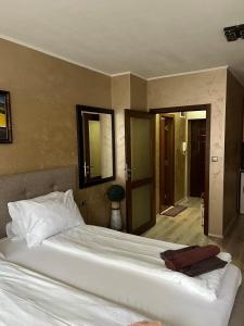 a bedroom with a large white bed in a room at Paradise dreams Velingrad in Velingrad