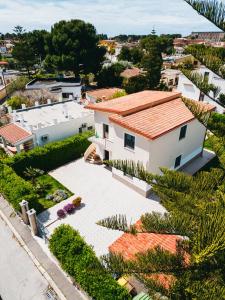 an aerial view of a white house with a roof at B&B Dimora Mariù in Taranto