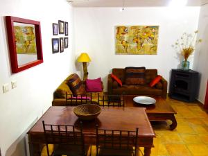 a living room with a table and a couch at A ChiOsella in Corbara